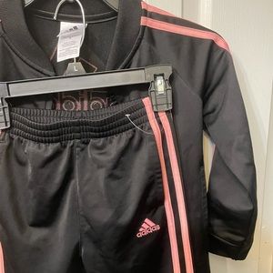 Adidas sweat suit.